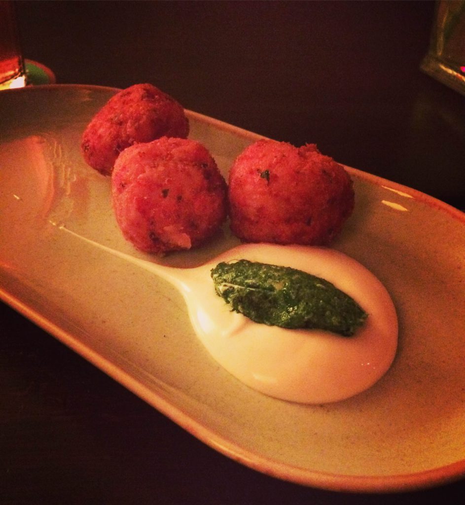 Roast tomato and smoked mozzarella arancini with mixed herbs and basil pesto